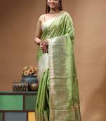 green crepe saree with desighner varanasi ghat theme zari border