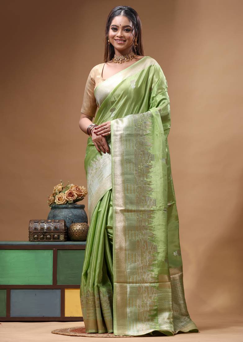 green crepe saree with desighner varanasi ghat theme zari border