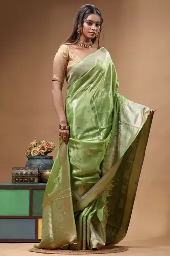 green crepe saree with desighner varanasi ghat theme zari border