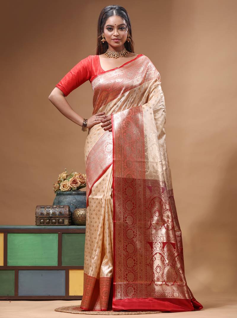 Beige katan silk saree with red & golden zari woven motifs border
