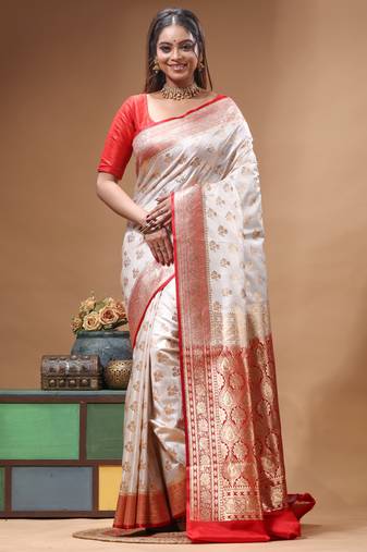 Off-white katan silk saree with gold zari woven border & red contrasting border