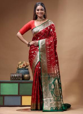 Red & green katan silk saree with zari woven border & traditional floral design 1