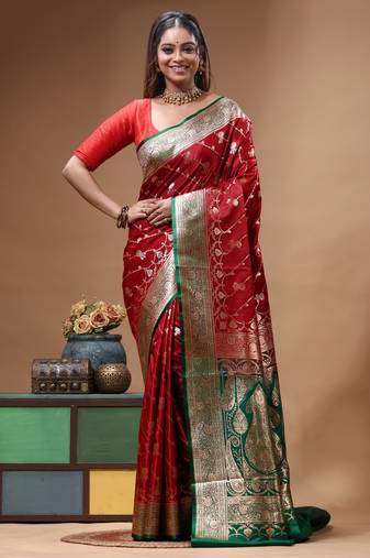 Red & green katan silk saree with zari woven border & traditional floral design