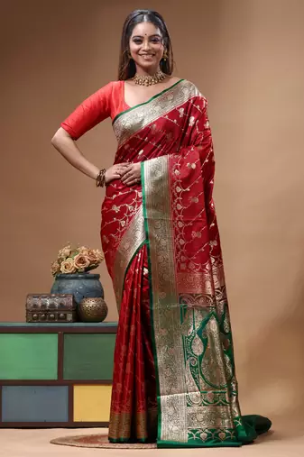 Red & green katan silk saree with zari woven border & traditional floral design