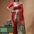 Red & green katan silk saree with zari woven border & traditional floral design