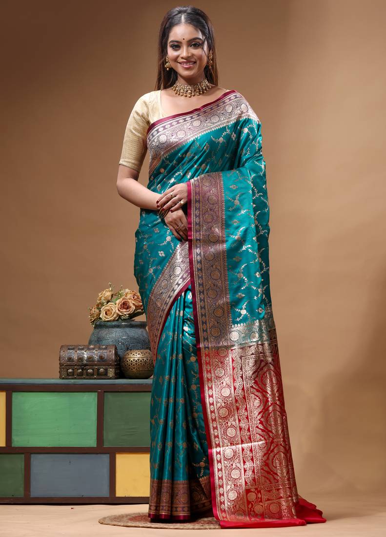 Teal green & red katan silk saree with zari woven border & traditional floral design