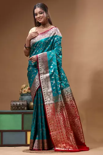 Teal green & red katan silk saree with zari woven border & traditional floral design