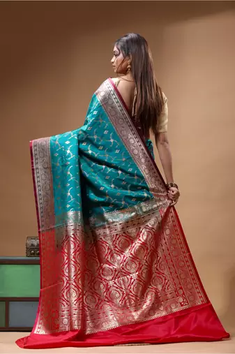 Teal green & red katan silk saree with zari woven border & traditional floral design
