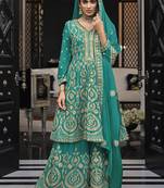 Faux georgette embroidered palazzo kameez in turquoise