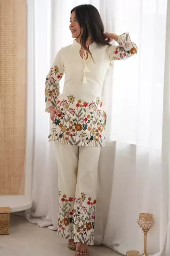 Women’s cream floral magic slub cotton kurta set with statement sleeves and flowing wide-leg palazzo