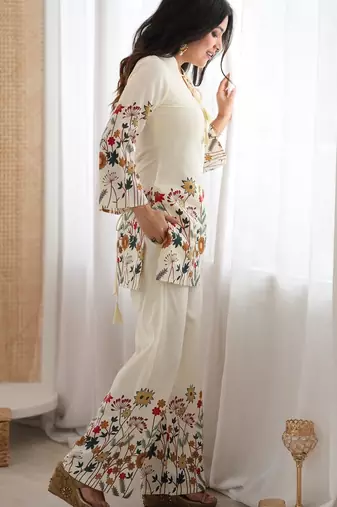 Women’s cream floral magic slub cotton kurta set with statement sleeves and flowing wide-leg palazzo