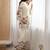 Women’s cream floral magic slub cotton kurta set with statement sleeves and flowing wide-leg palazzo