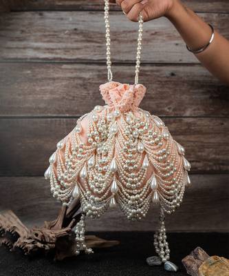 Blush pink embroidered suede potli bag 1