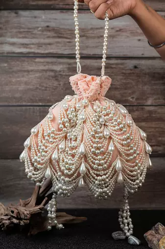 Blush pink embroidered suede potli bag