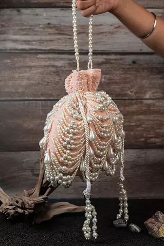 Blush pink embroidered suede potli bag