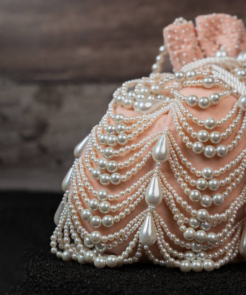 Blush pink embroidered suede potli bag