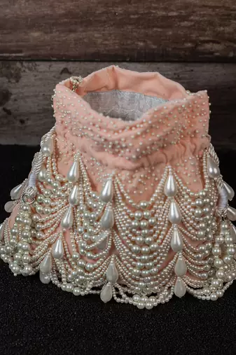 Blush pink embroidered suede potli bag