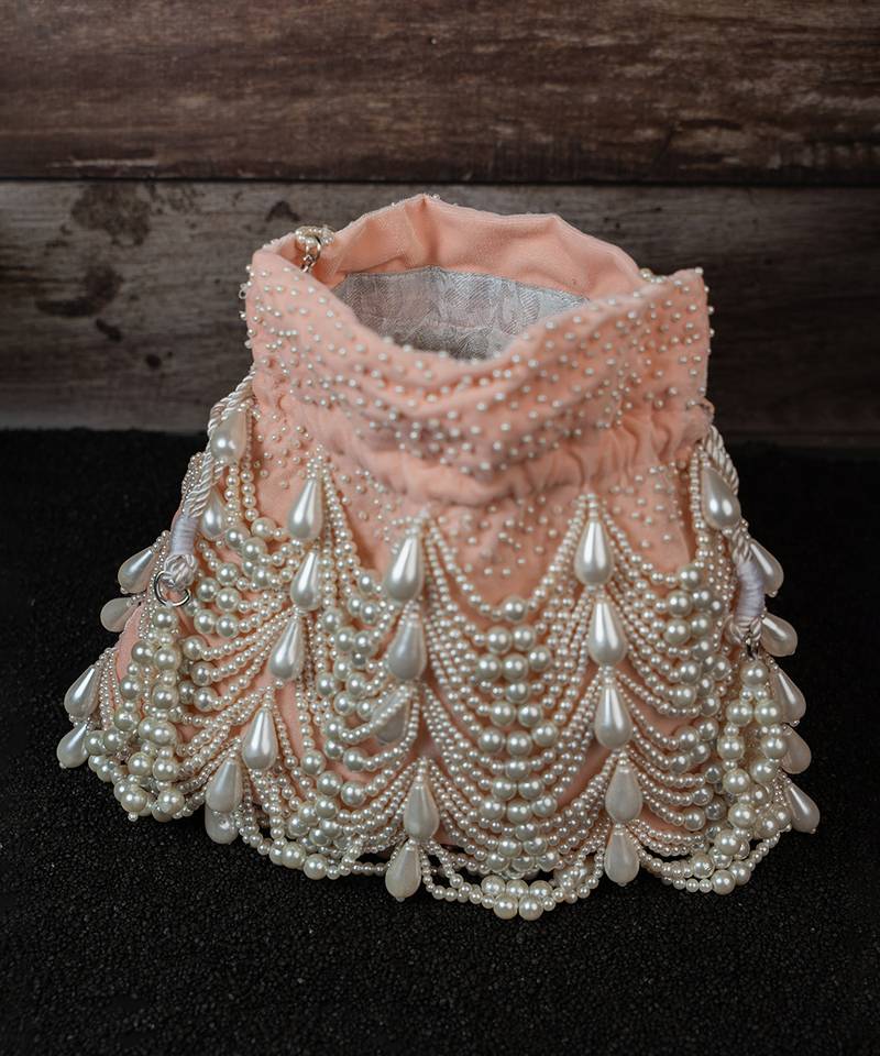 Blush pink embroidered suede potli bag