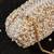 White pearl embroidered silk clutch