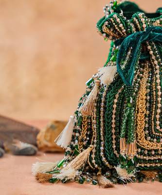 Emerald green embroidered silk potli bag 4