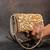 Gold kundan embroidered silk clutch