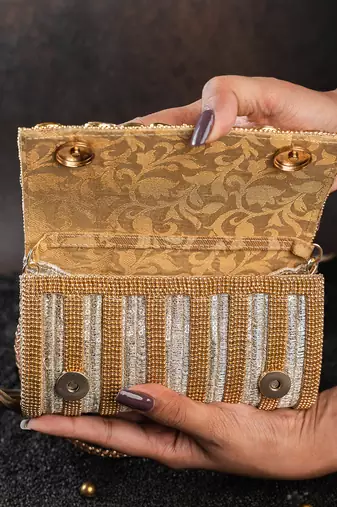 Gold kundan embroidered silk clutch