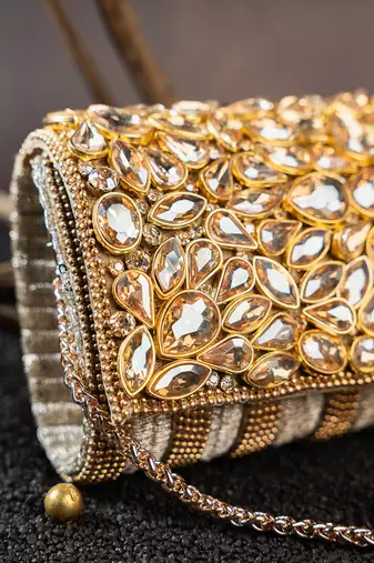 Gold kundan embroidered silk clutch