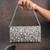 Silver kundan embroidered silk clutch