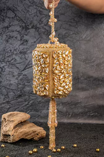 Gold kundan embroidered silk cylindrical bag