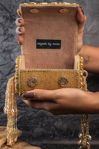 Gold kundan embroidered silk cylindrical bag