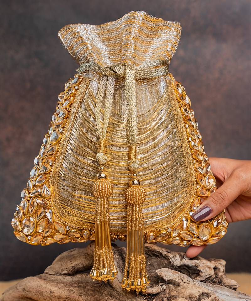 Gold hinted diamond embroidered silk potli bag
