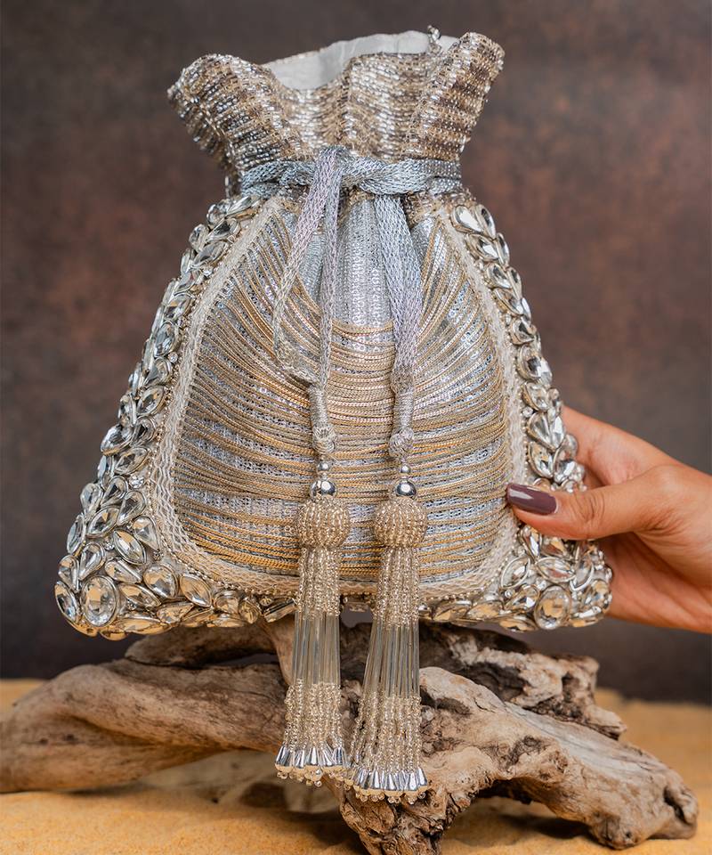 Silver hinted diamond embroidered silk potli bag
