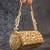Gold embroidered silk capsule clutch