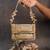 Slate gold hinted embroidered silk clutch