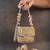 Slate gold hinted embroidered silk clutch