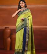 Lime green and navy blue cotton saree with geometric woven border