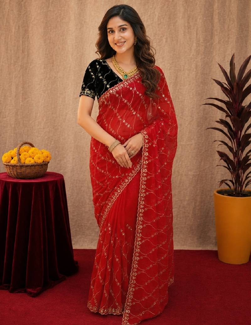 Red  soft net sequence emboidery saree with unstitched blouse piece