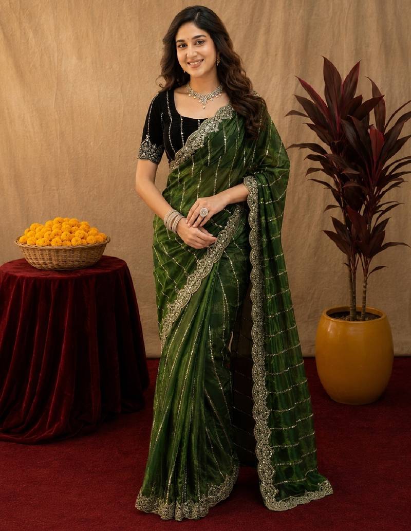 Green  soft net sequence emboidery saree with unstitched blouse piece