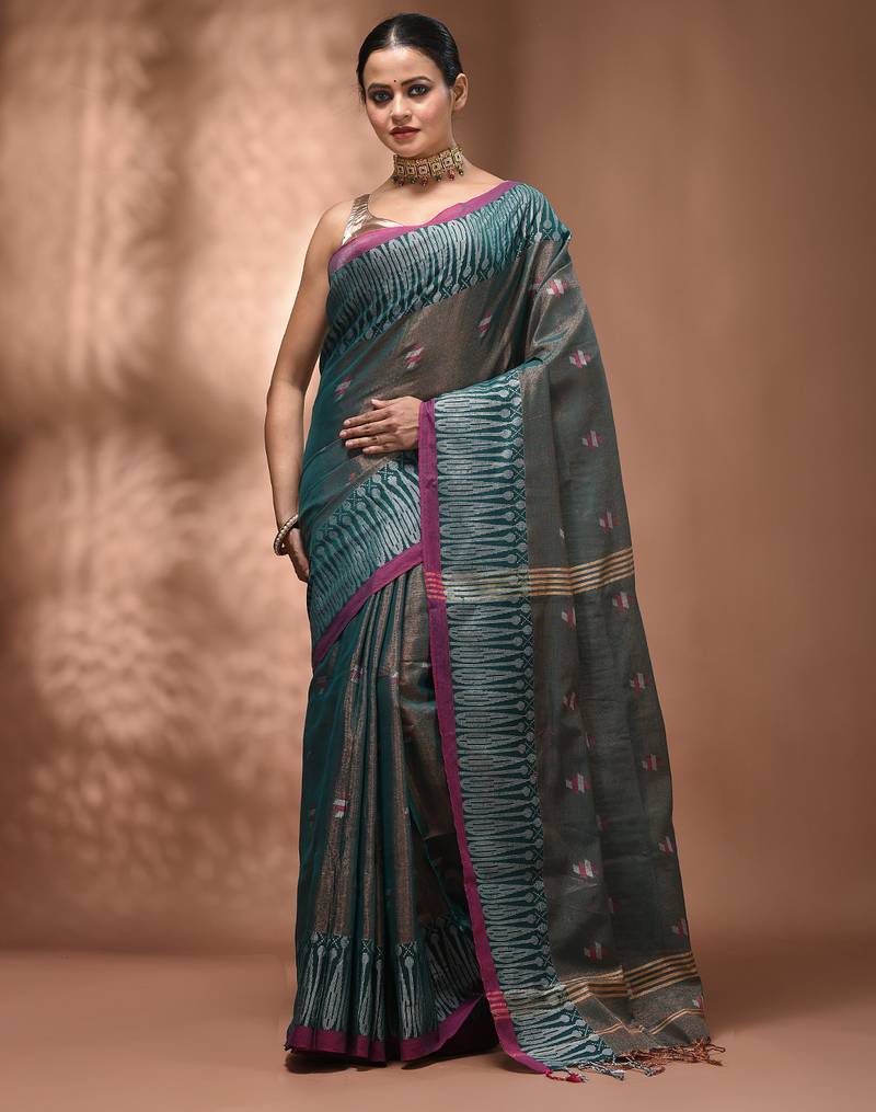 Teal coloured handwoven tissue saree with woven design