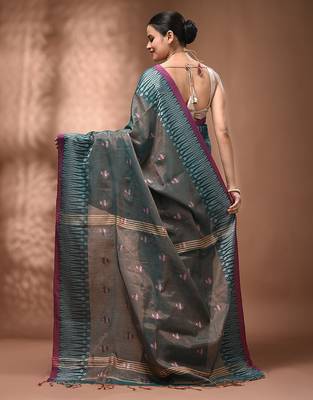 Teal coloured handwoven tissue saree with woven design 2