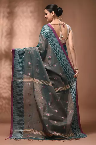 Teal coloured handwoven tissue saree with woven design
