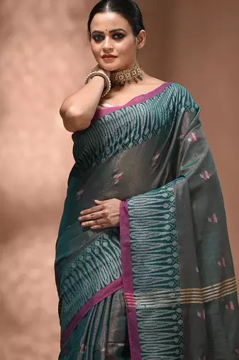 Teal coloured handwoven tissue saree with woven design