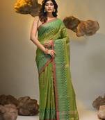 Light green coloured handwoven tissue saree with woven design