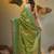Light green coloured handwoven tissue saree with woven design
