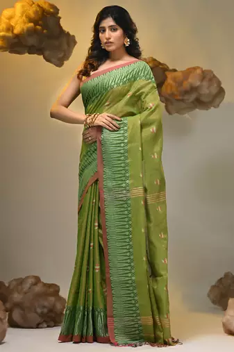 Light green coloured handwoven tissue saree with woven design