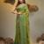 Light green coloured handwoven tissue saree with woven design