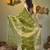 Parrot green texture motifs tissue saree with stripes pallu