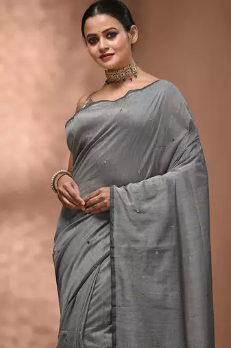 Elegant grey cotton saree with sequin embellishments and pom pom