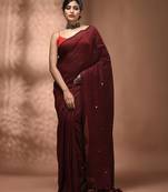 Elegant maroon cotton saree with sequin embellishments and pom pom