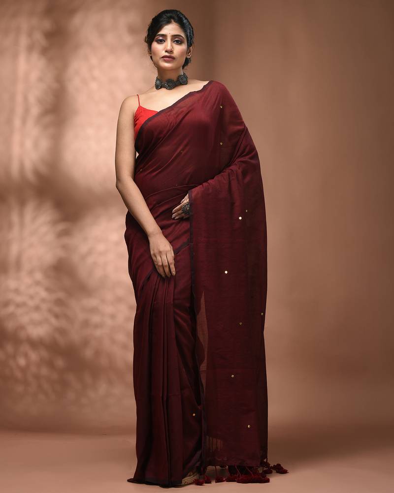 Elegant maroon cotton saree with sequin embellishments and pom pom